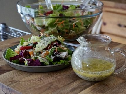 Homemade Italian Dressing Recipe served over a salad of assorted fresh vegetables.