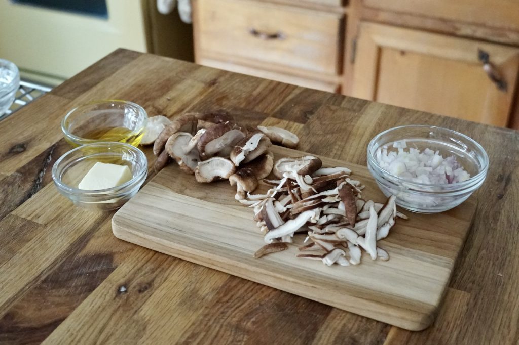 A knob of butter plus sliced shiitake mushrooms and a chopped shallot.