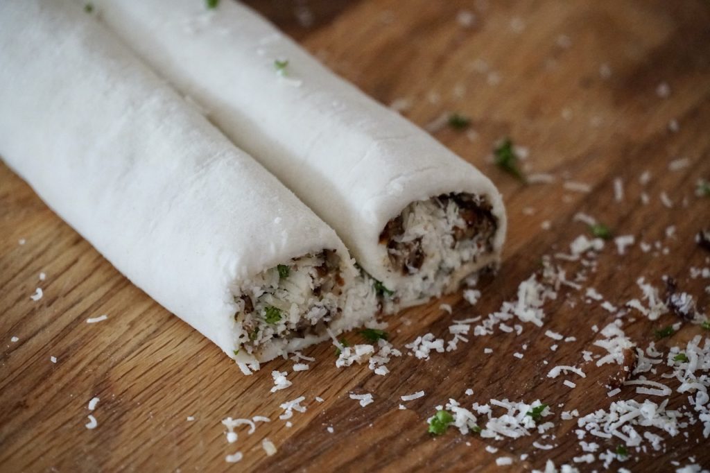 The Puff Pastry after being filled and rolled into a palmier, elephant's ear or heart shape.
