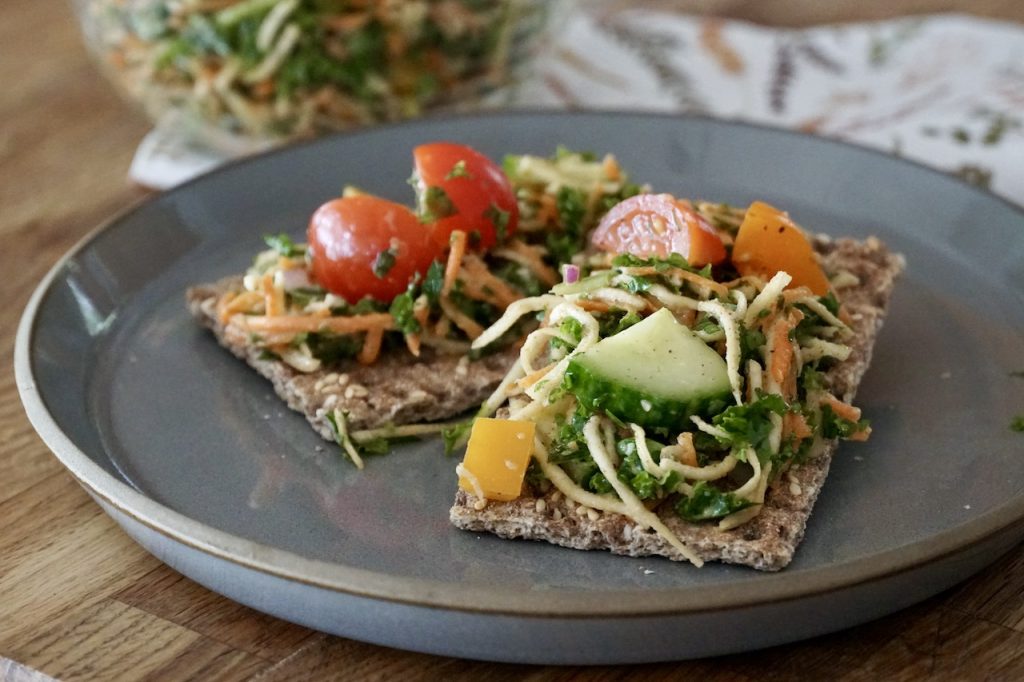 Healthy slaw serve as a snack on multigrain crackers.