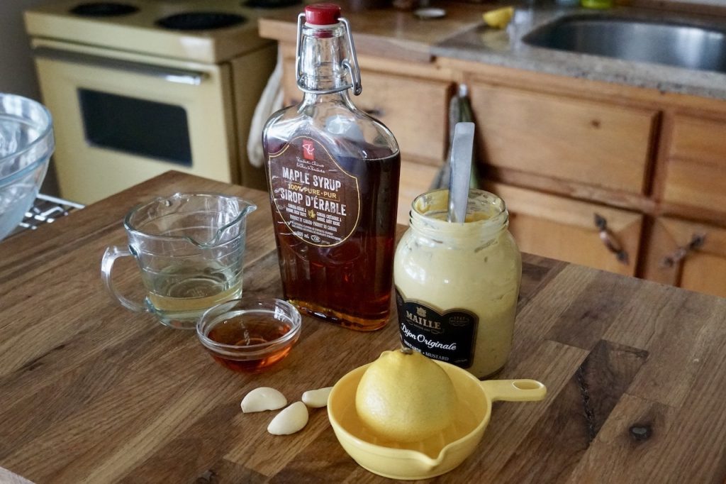 Maple syrup, Dijon mustard, garlic, lemon juice and oil.