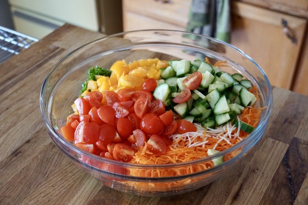 The vegetable coleslaw topped with Ontario Greenhouse tomatoes, cucumbers and bell peppers.