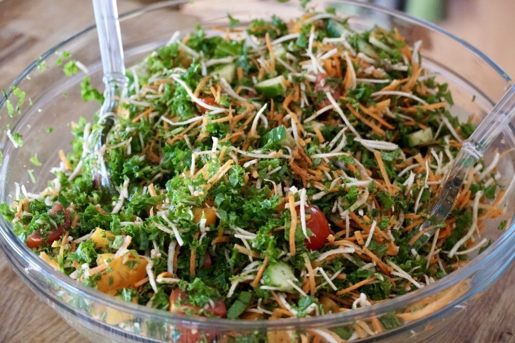Healthy Slaw Recipe tossed together in a large bowl.