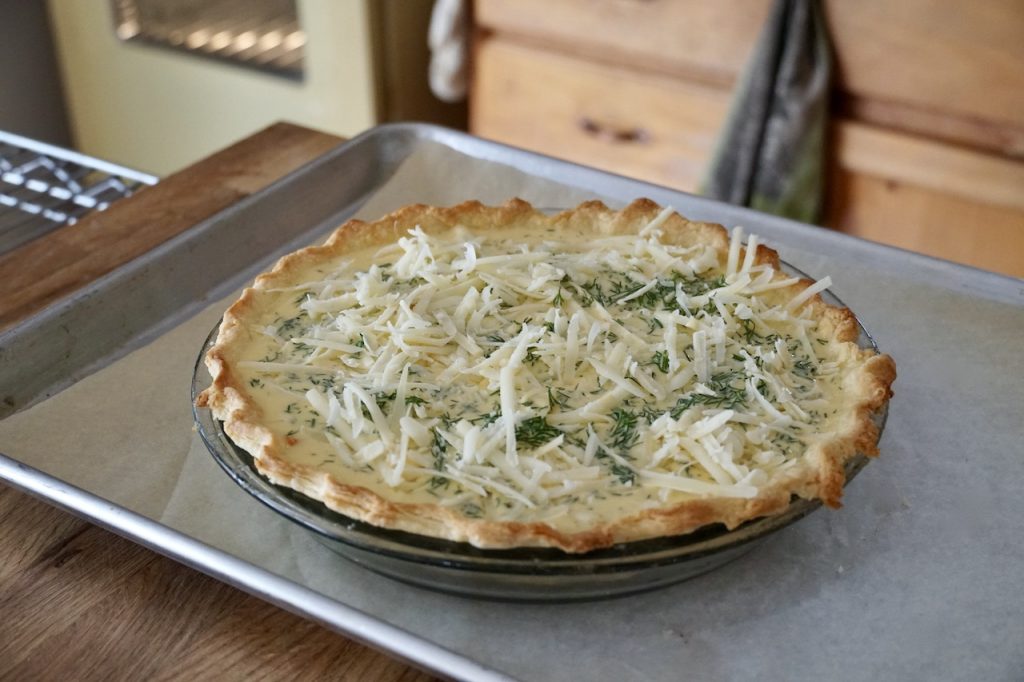The homemade Smoked Salmon Quiche assembled and ready to be transferred to the oven for baking.