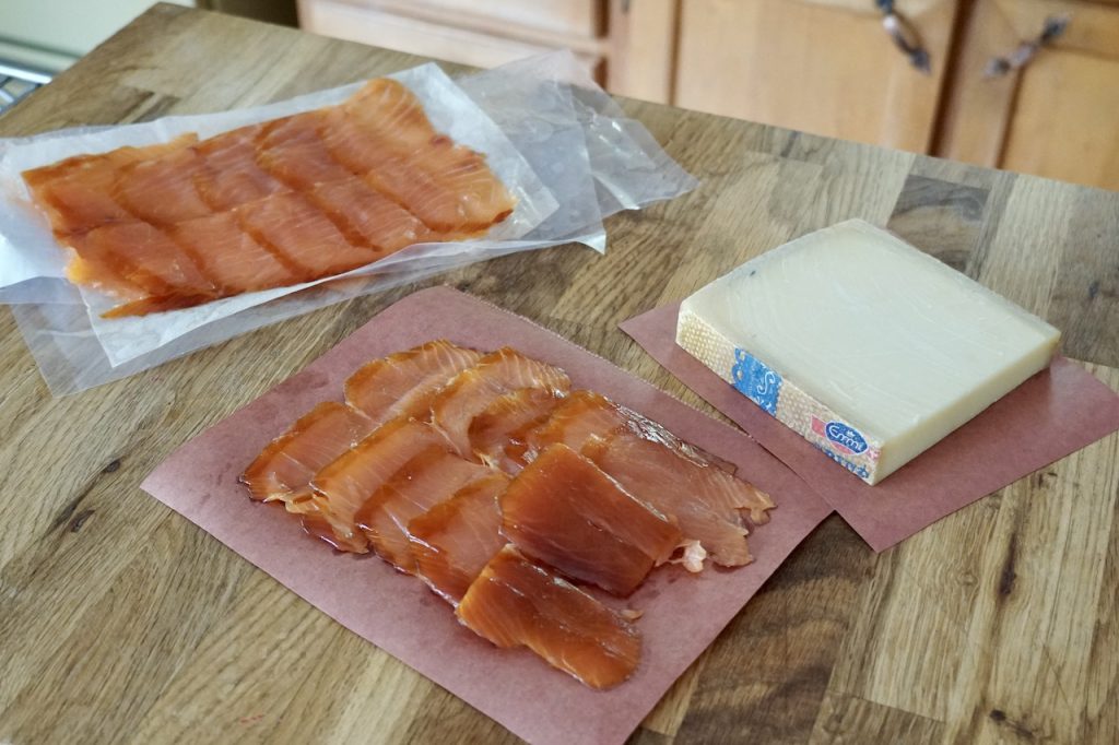 Sheets of doule smoked salmon and a hunk of nutty Gruyère cheese.