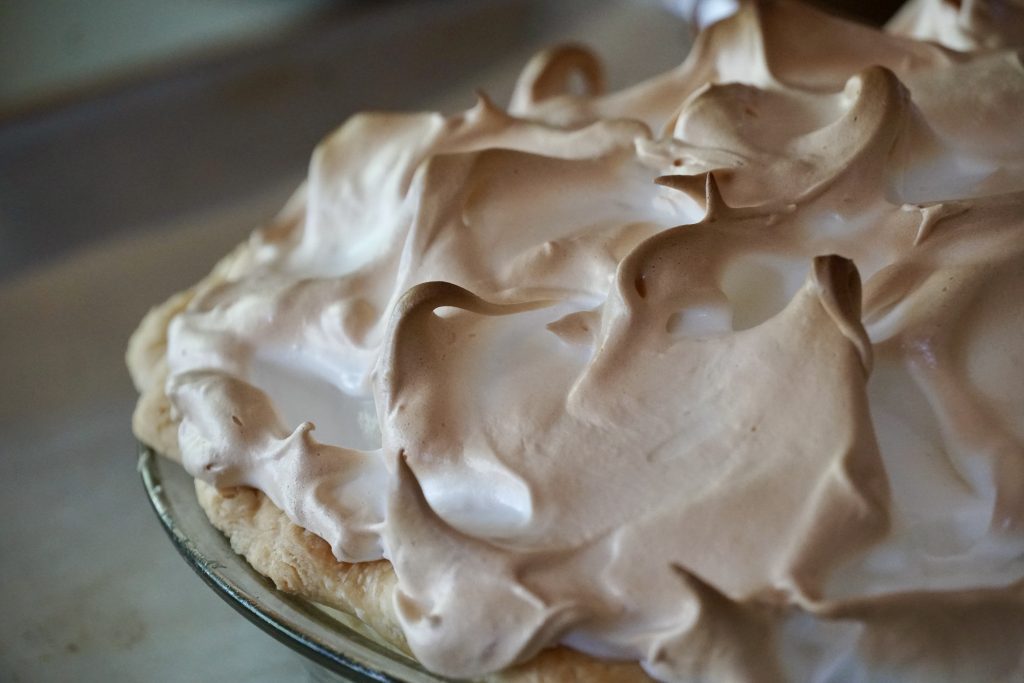 Wispy curls of toasted meringue on top of a lemon pie.