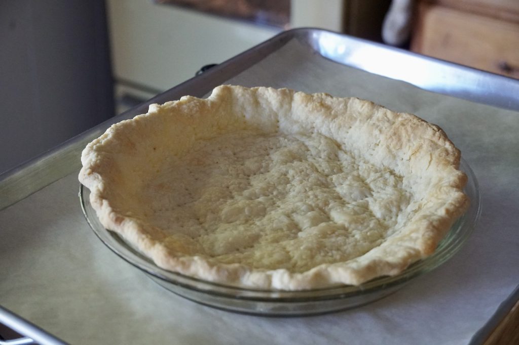 The pie crust fresh from thew oven, blind-baked.