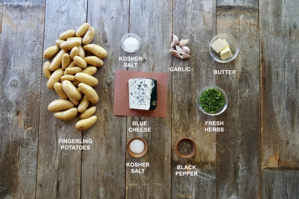 All of the ingredients needed to make smashed potatoes with blue cheese.