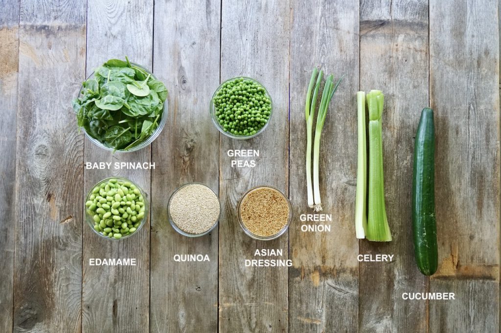 Ingredients for a Healthy Quinoa Salad include: quinoa, edamame, peas, dressing, green onions, celery, spinach and cucumber.