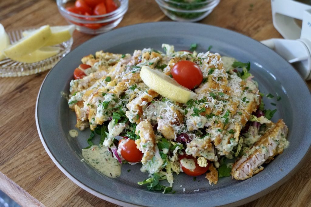 Crispy pork schnitzel with crunchy slaw.