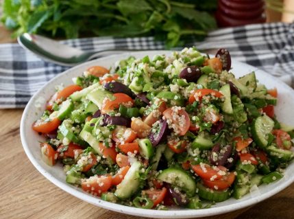 A large bowl filled with an Easy Summer Salad.