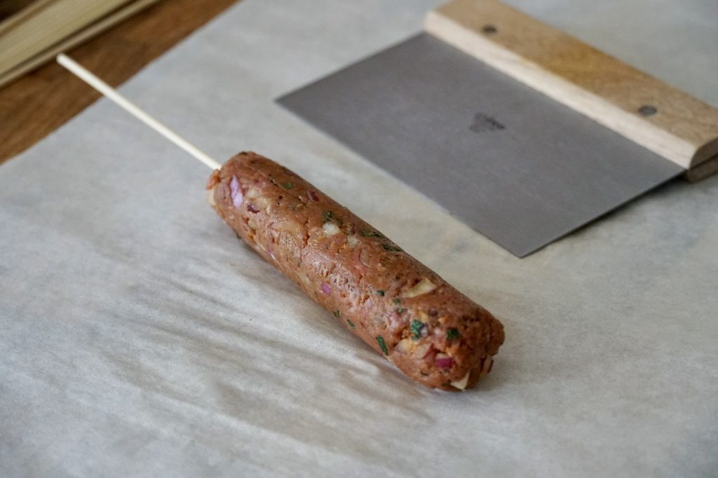 A perfectly shaped veal kofta kebab.