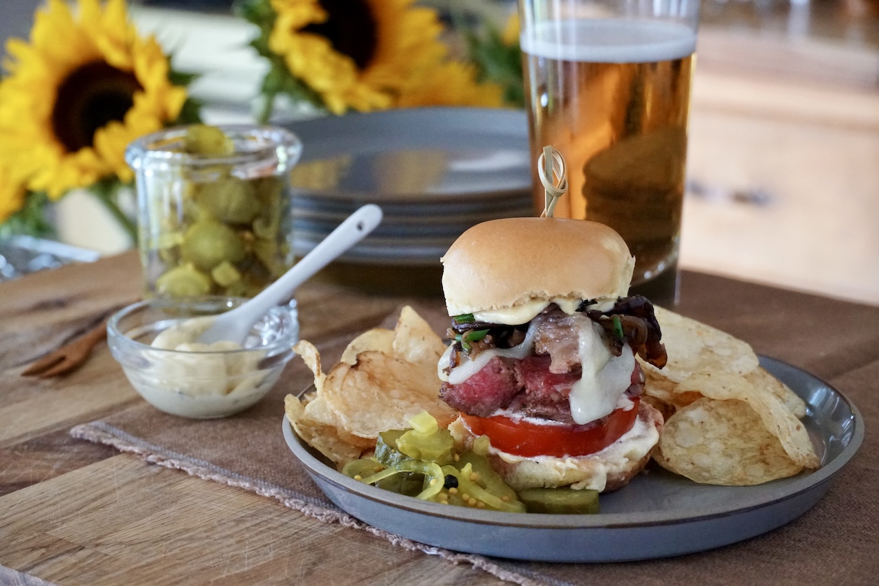 Grilled Steak Sandwiches served with potato chips, coleslaw and bread and butter pickles.