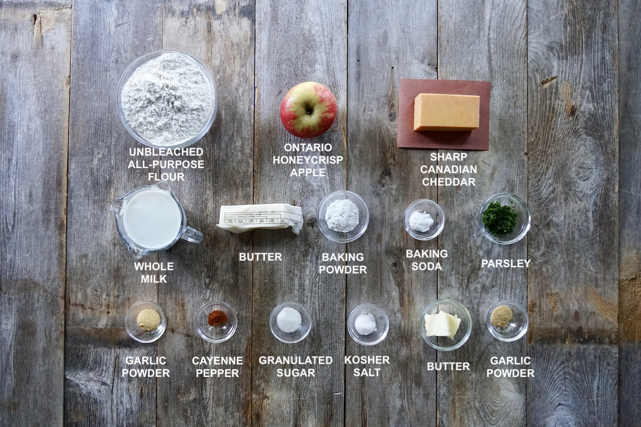 All of the ingredients needed to make buttery, flaky apple and cheddar cheese biscuits.