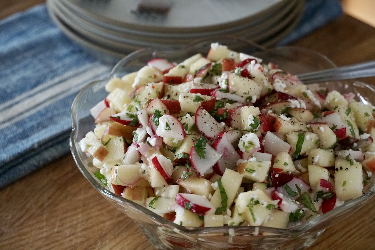 A bowl containing the Crunchy Apple Salad.