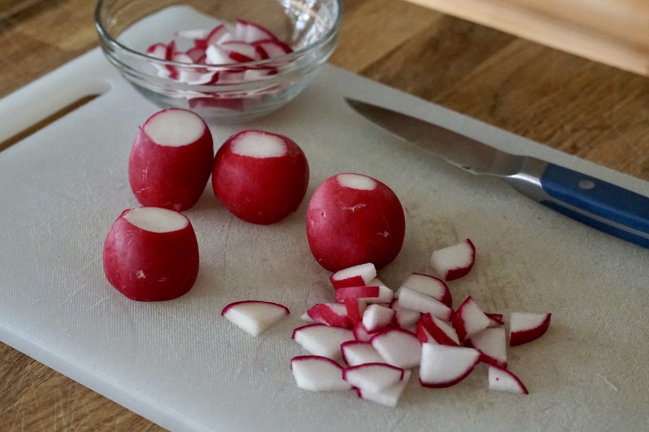 Fresh radishes quartered and thinly sliced.