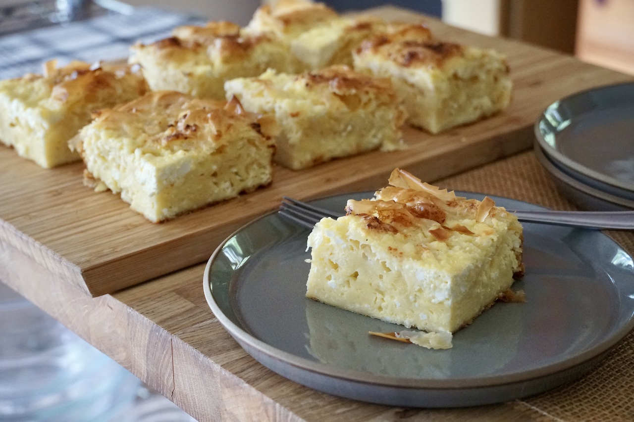 A square of Gibanica, a Serbian cheese pie ready to be enjoyed.