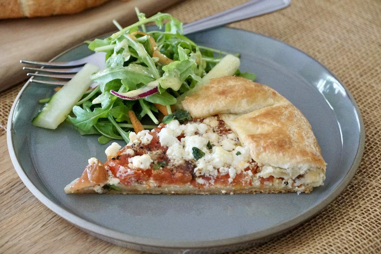 A wedge of the Tomato Galette Recipe served with a simple salad.