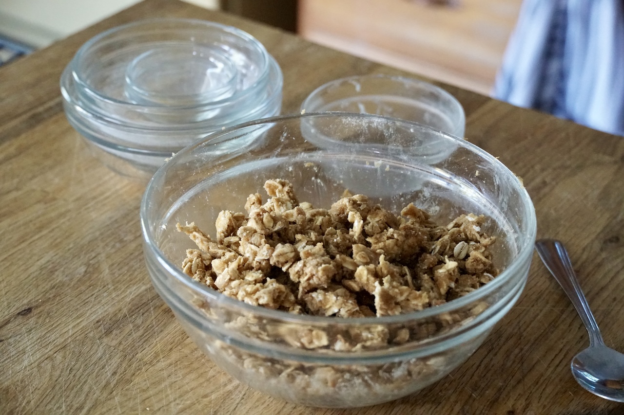 The topping for the apple pie crumble bars assembled in a medium bowl.