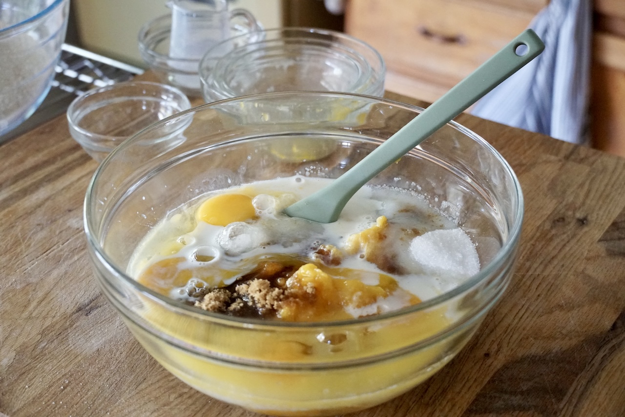 All of the wet ingredients for the cake recipe poured into a large bowl.