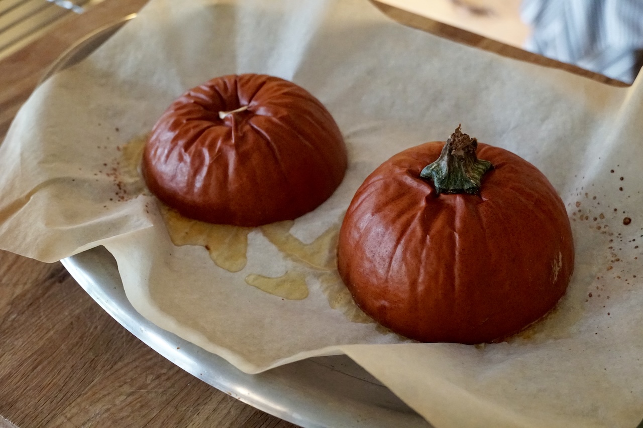Two halves of a sugar pumpkin after being oven roasted.