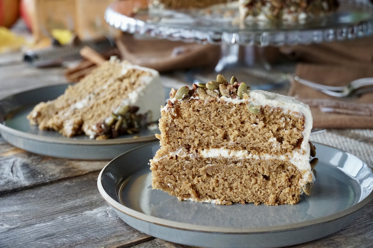 Two pieces of Spiced Pumpkin Cake served onto dessert plates.