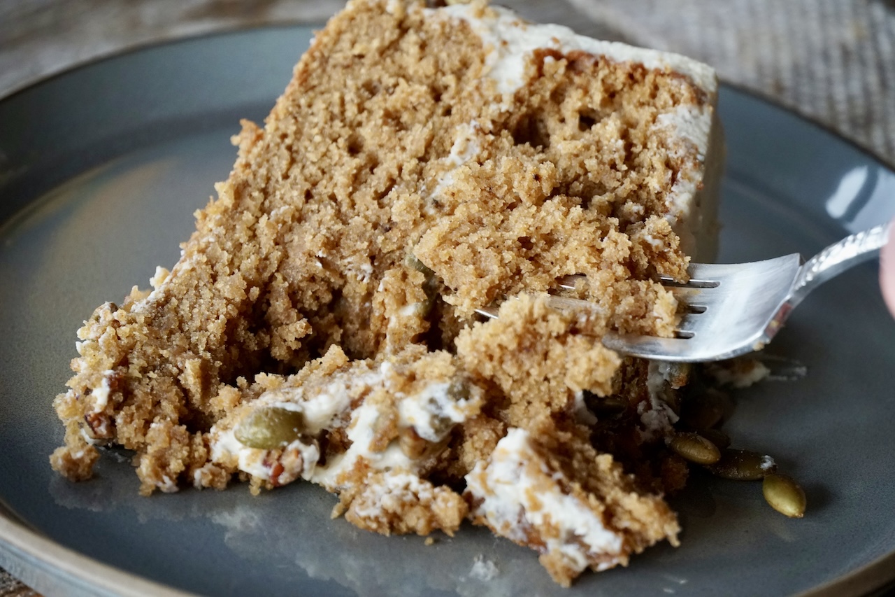 A fork going into the tender and moist Spiced Pumpkin Cake.
