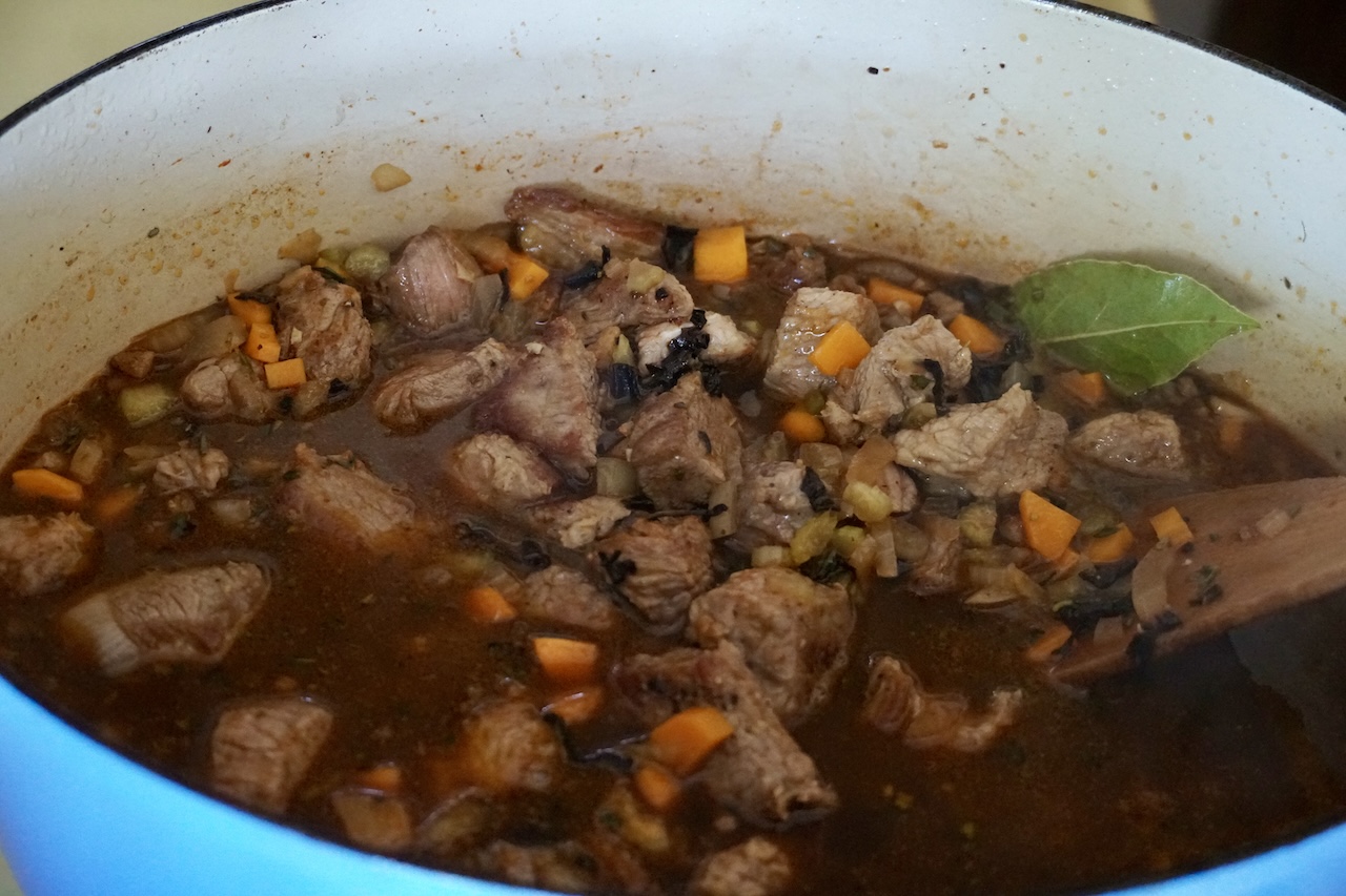 The seared veal returned to the pot.