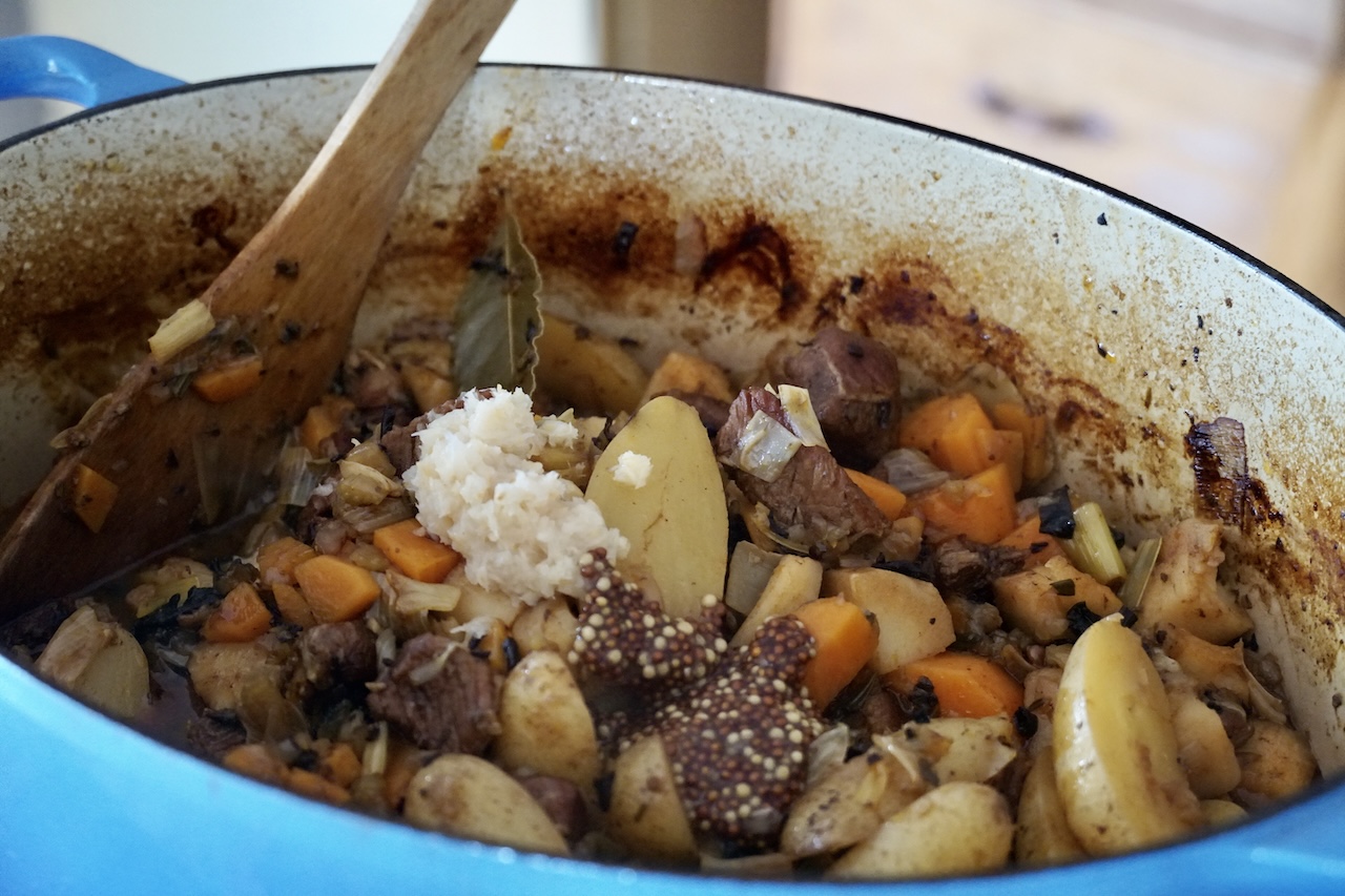 The stew topped with horseradish, mustard and balsamic vinegar.
