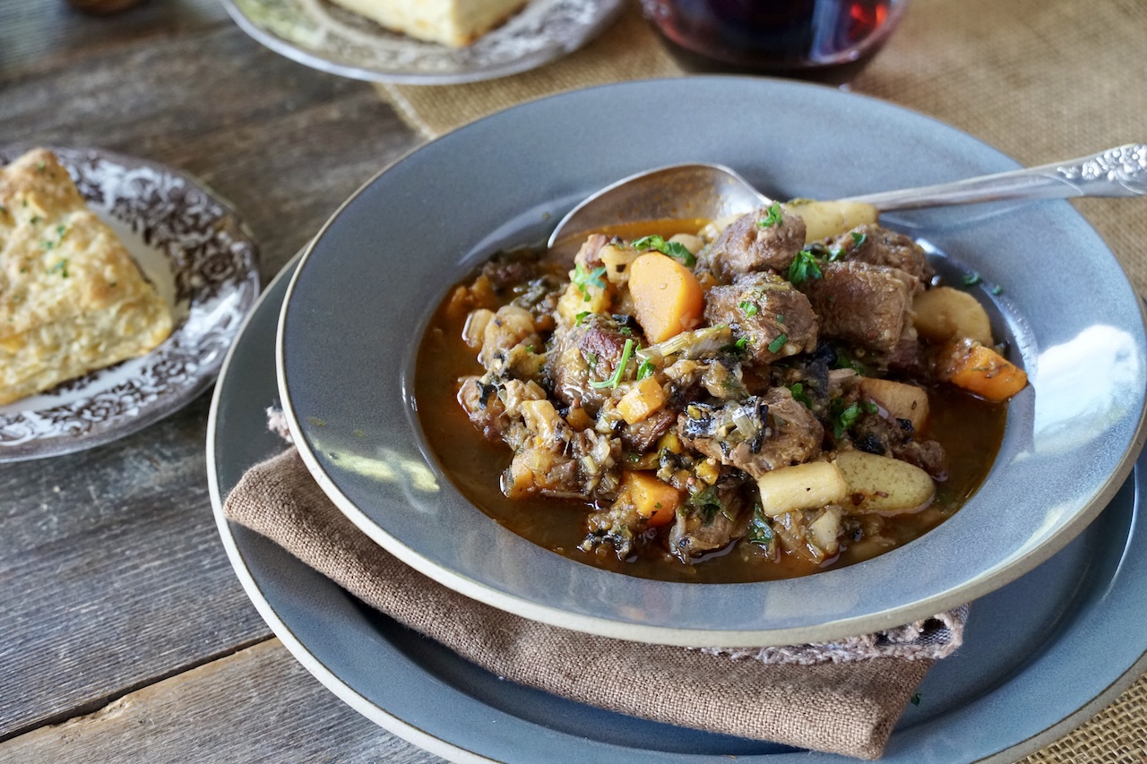 Veal Stew Recipe served with red wine and biscuits.