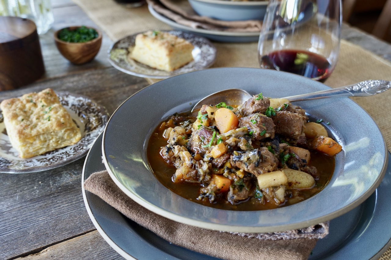 Veal Stew Recipe served with red wine and biscuits.