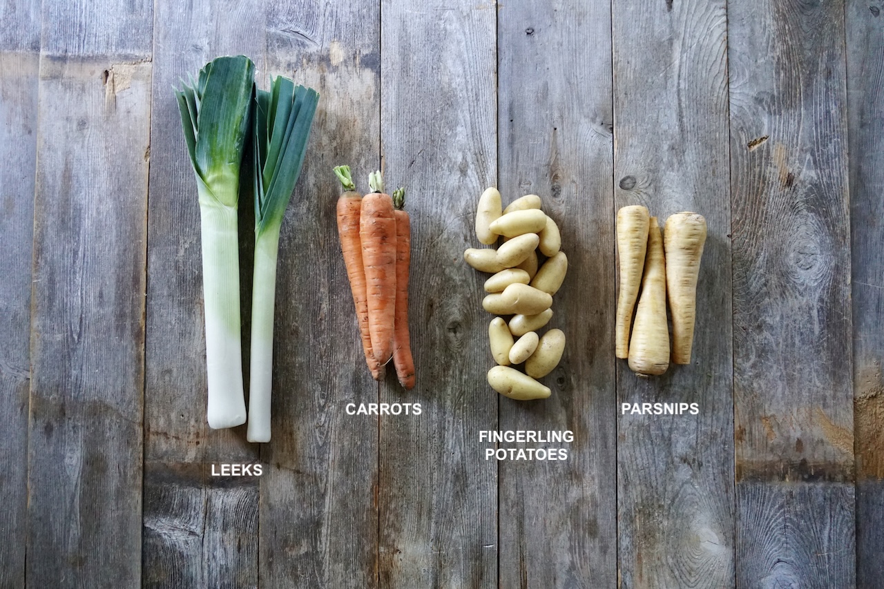 The vegetables for the stew including carrots, parsnips, potatoes and leeks.